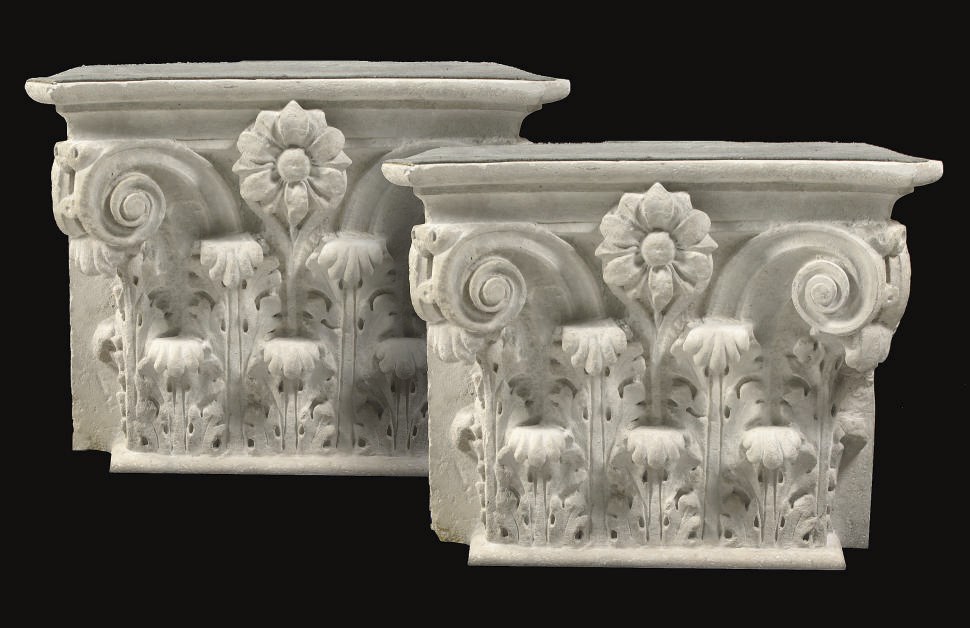 A PAIR OF CARVED SANDSTONE COMPOSITE CAPITALS