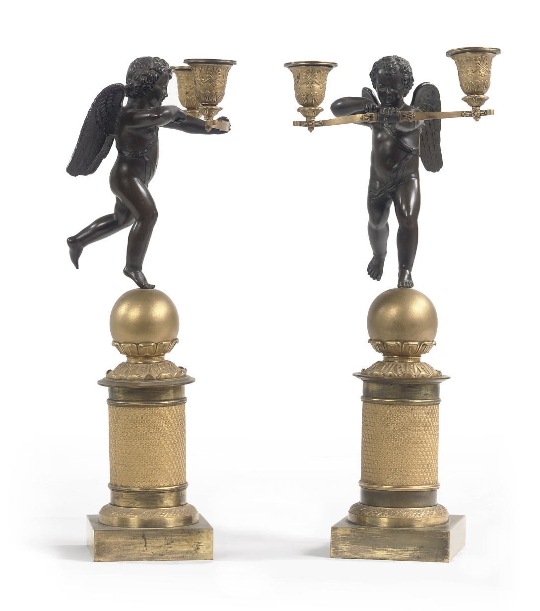 A PAIR OF EMPIRE ORMOLU AND PATINATED BRONZE FIGURAL CANDLESTICKS