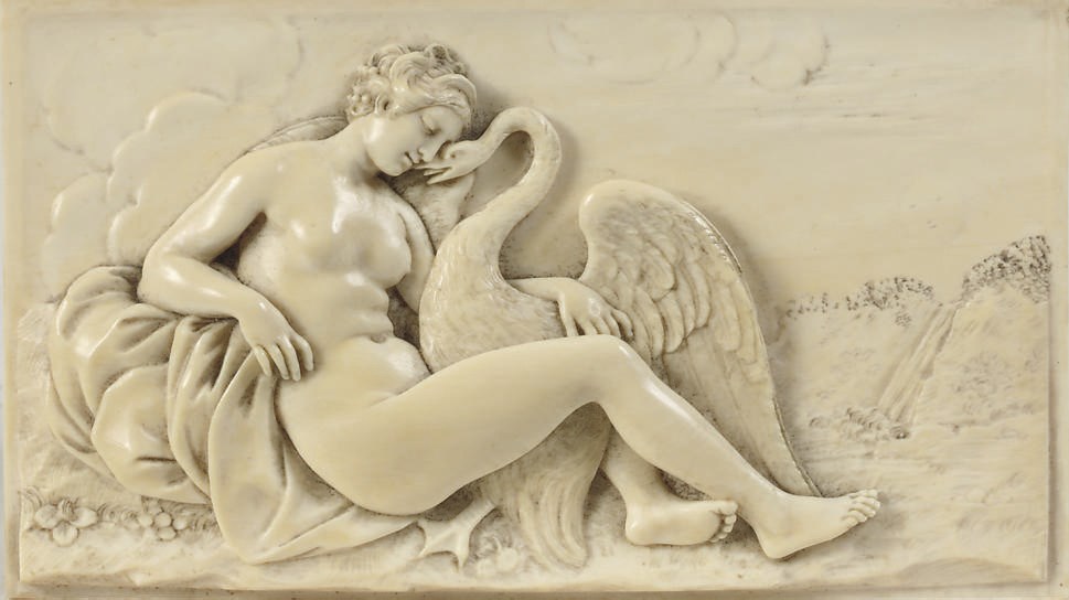 A CARVED IVORY RELIEF DEPICTING LEDA AND THE SWAN