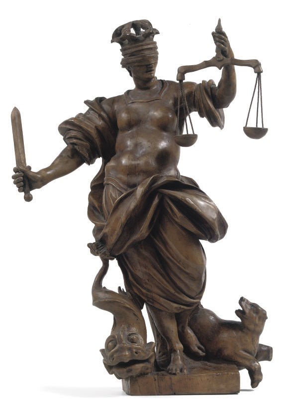 A CARVED LIMEWOOD FIGURE OF JUSTICE