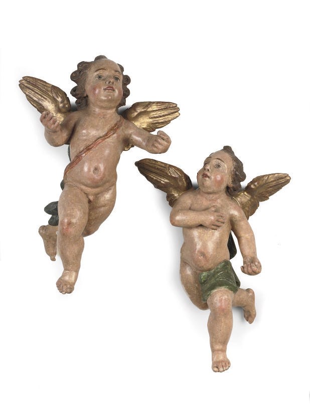 A PAIR OF POLYCHROME AND PARCEL-GILT CARVED LIMEWOOD FIGURES OF CHERUBS