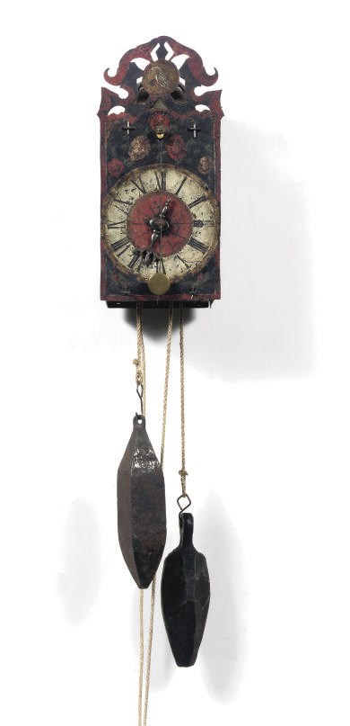 A GERMAN POLYCHROME PAINTED IRON STRIKING WALL CLOCK