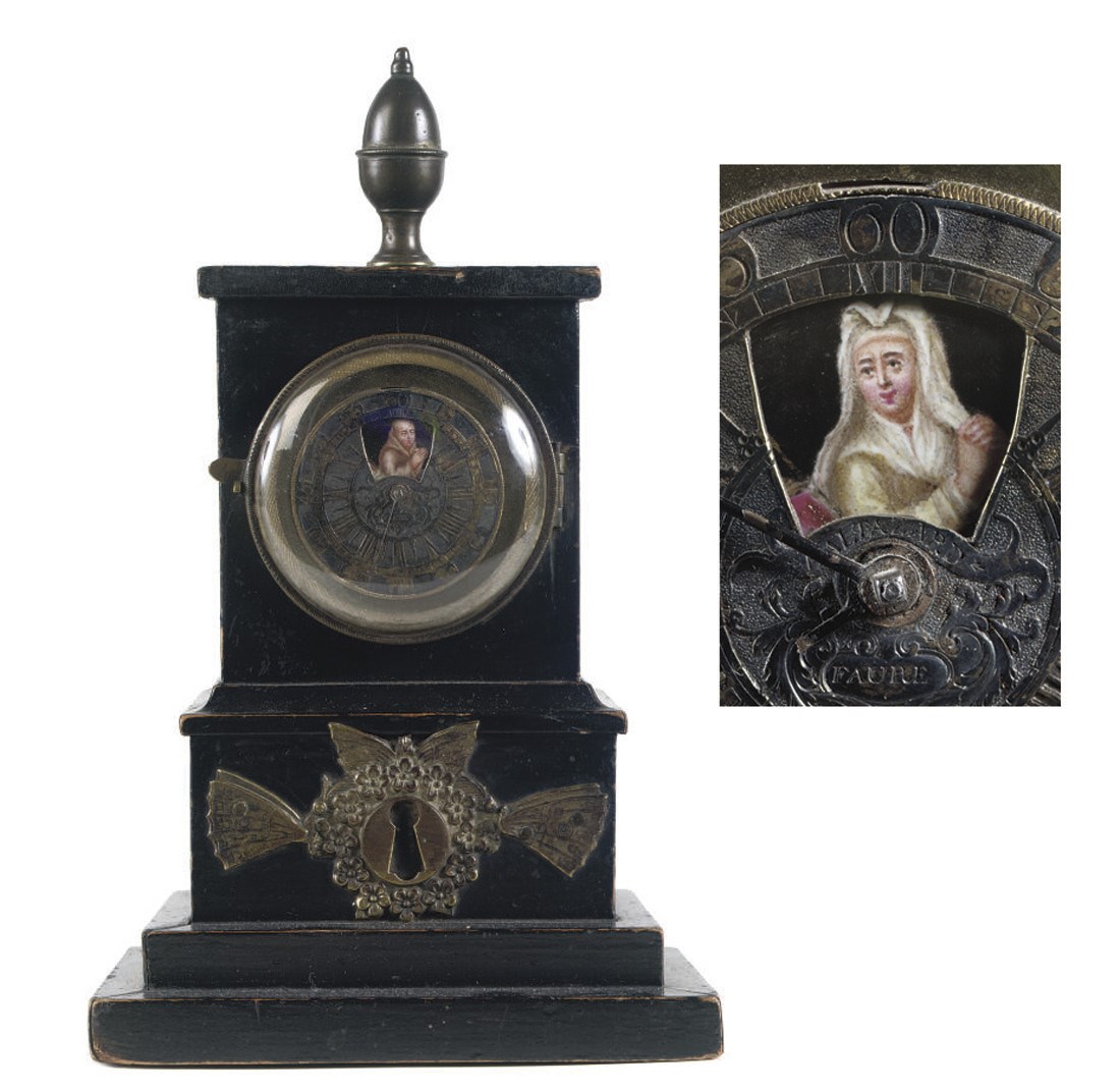 AN EBONIZED POCKET WATCH HOLDER WITH WATCH MOVEMENT