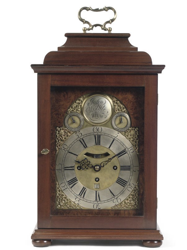 AN AUSTRIAN WALNUT QUARTER-STRIKING AND REPEATING TABLE CLOCK