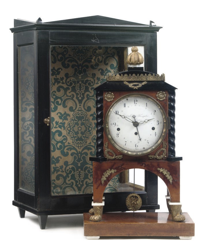 A SOUTH-GERMAN BIEDERMEIER BRASS-MOUNTED STAINED MAPLE AND EBONIZED GRANDE SONNERIE MANTEL CLOCK