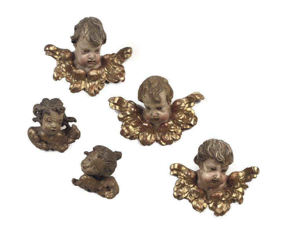 A SET OF THREE POLYCHROME AND PARCEL-GILT CARVED LIMEWOOD CHERUBS