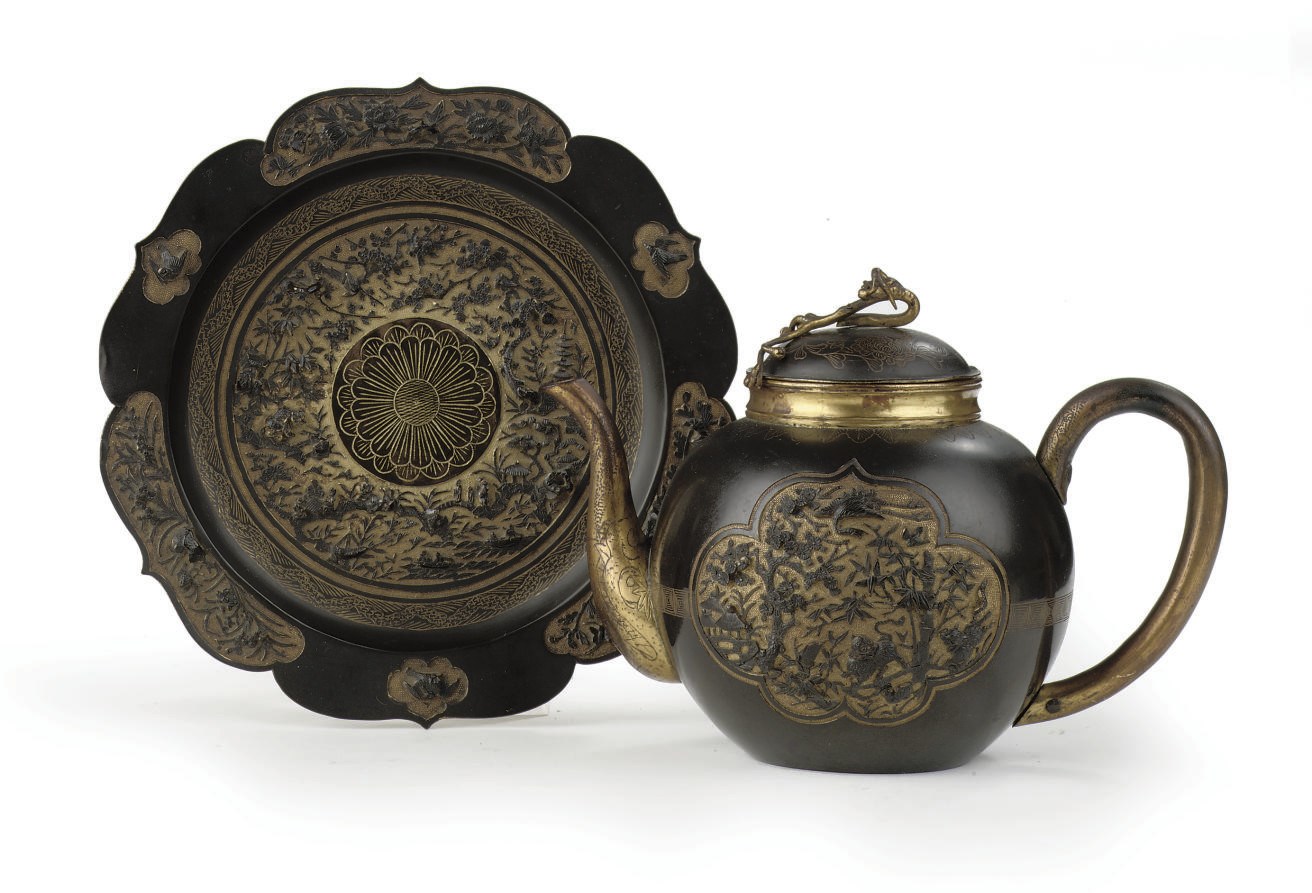 A Japanese sawasa ware teapot and stand