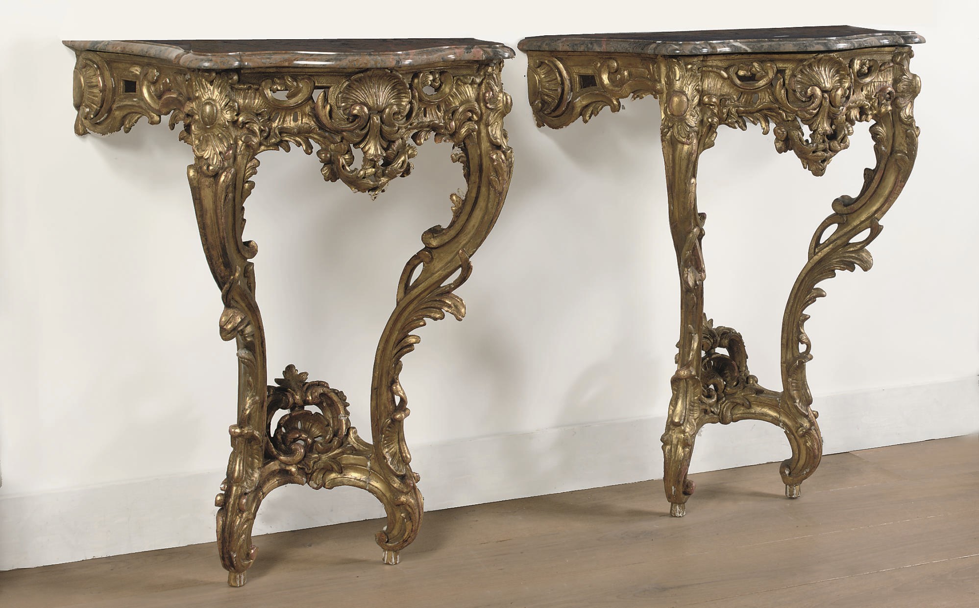 A PAIR OF LOUIS XV GILTWOOD CONSOLE TABLES