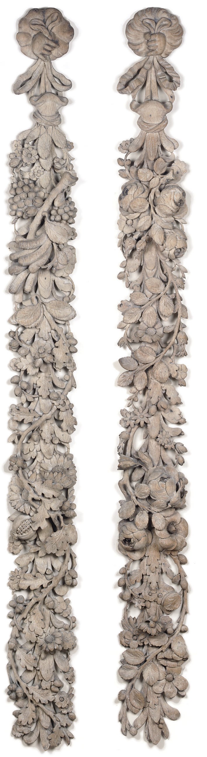 A PAIR OF DUTCH LIME WASHED FESTOONS