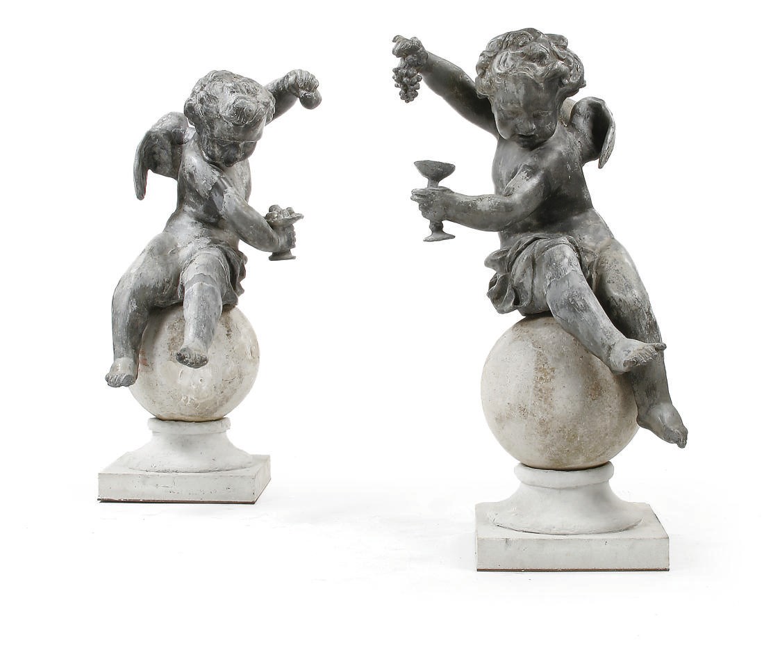 A PAIR OF LEAD FIGURES OF CHERUBS
