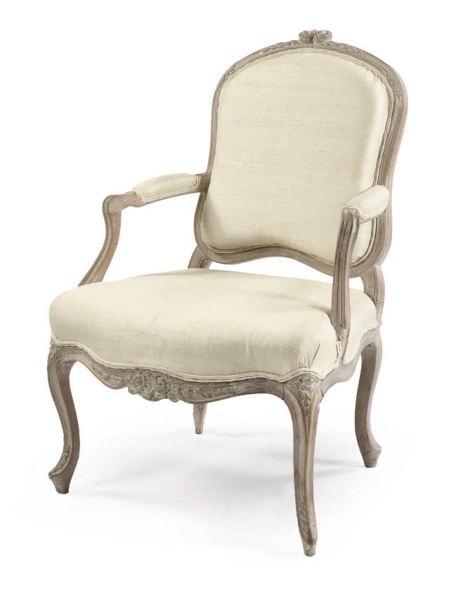 A LATE LOUIS XV LIME-WASHED BEECHWOOD FAUTEUIL