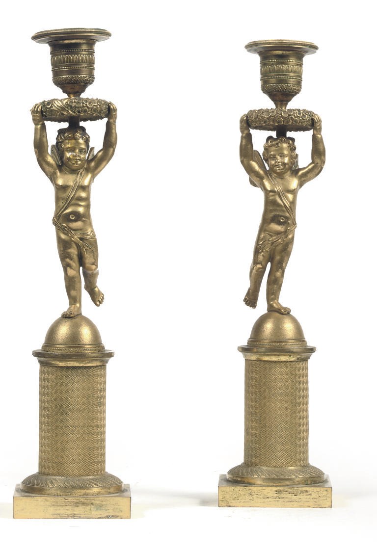 A PAIR OF RESTAURATION ORMOLU FIGURAL CANDLESTICKS