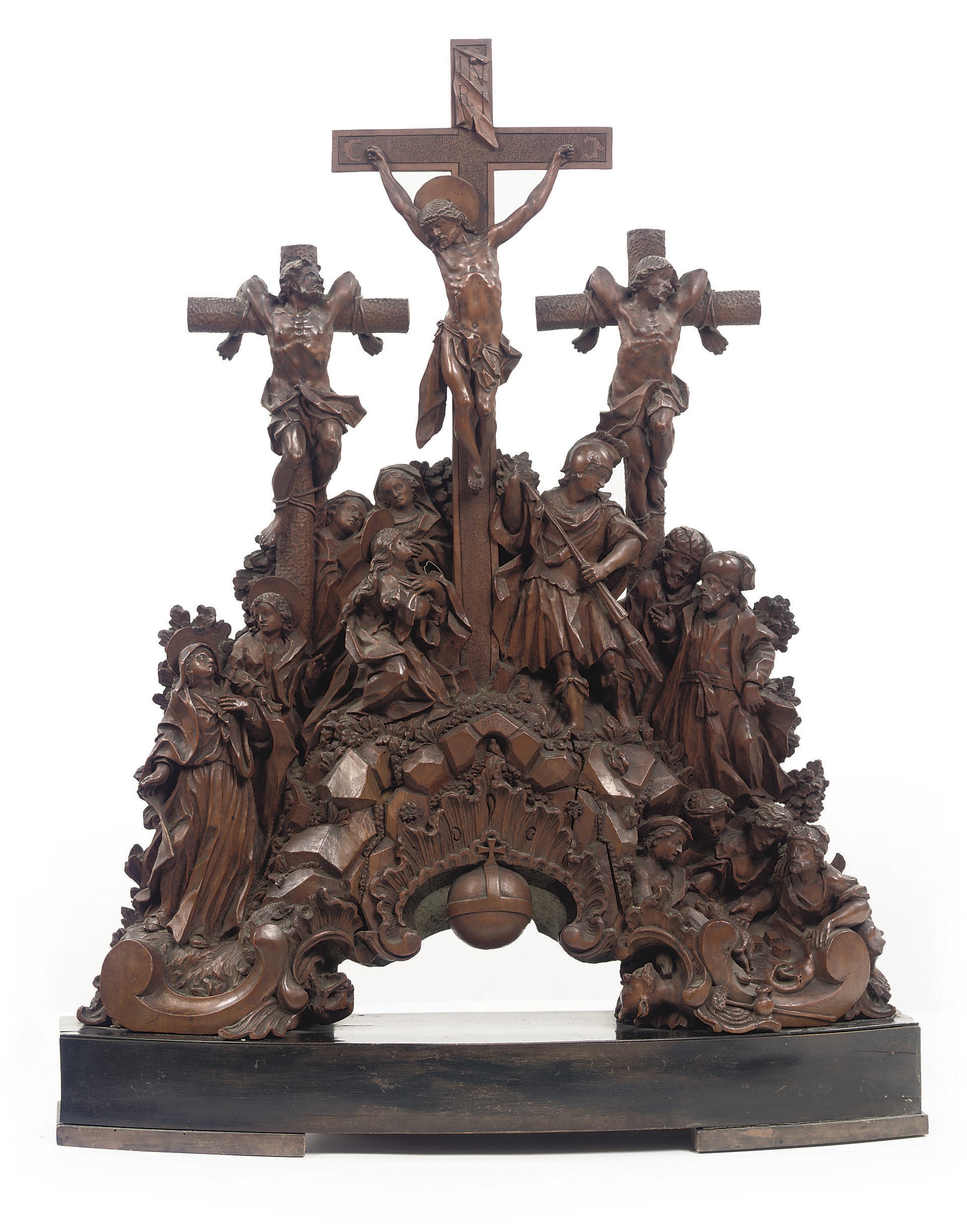 A CARVED PALMWOOD GROUP OF THE CRUCIFIXION