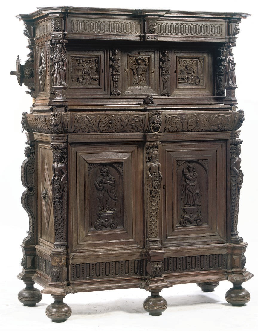 A FLEMISH CARVED OAK CUPBOARD
