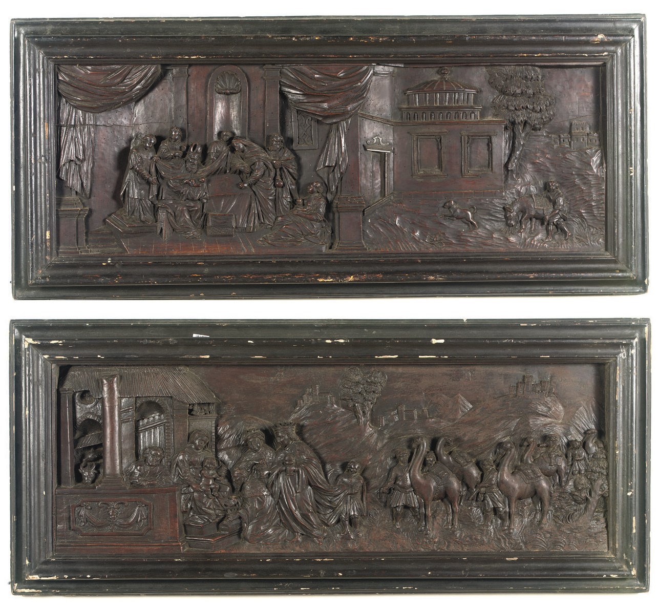 A PAIR OF SOUTH GERMAN EBONIZED CARVED WOOD RELIEF PANELS