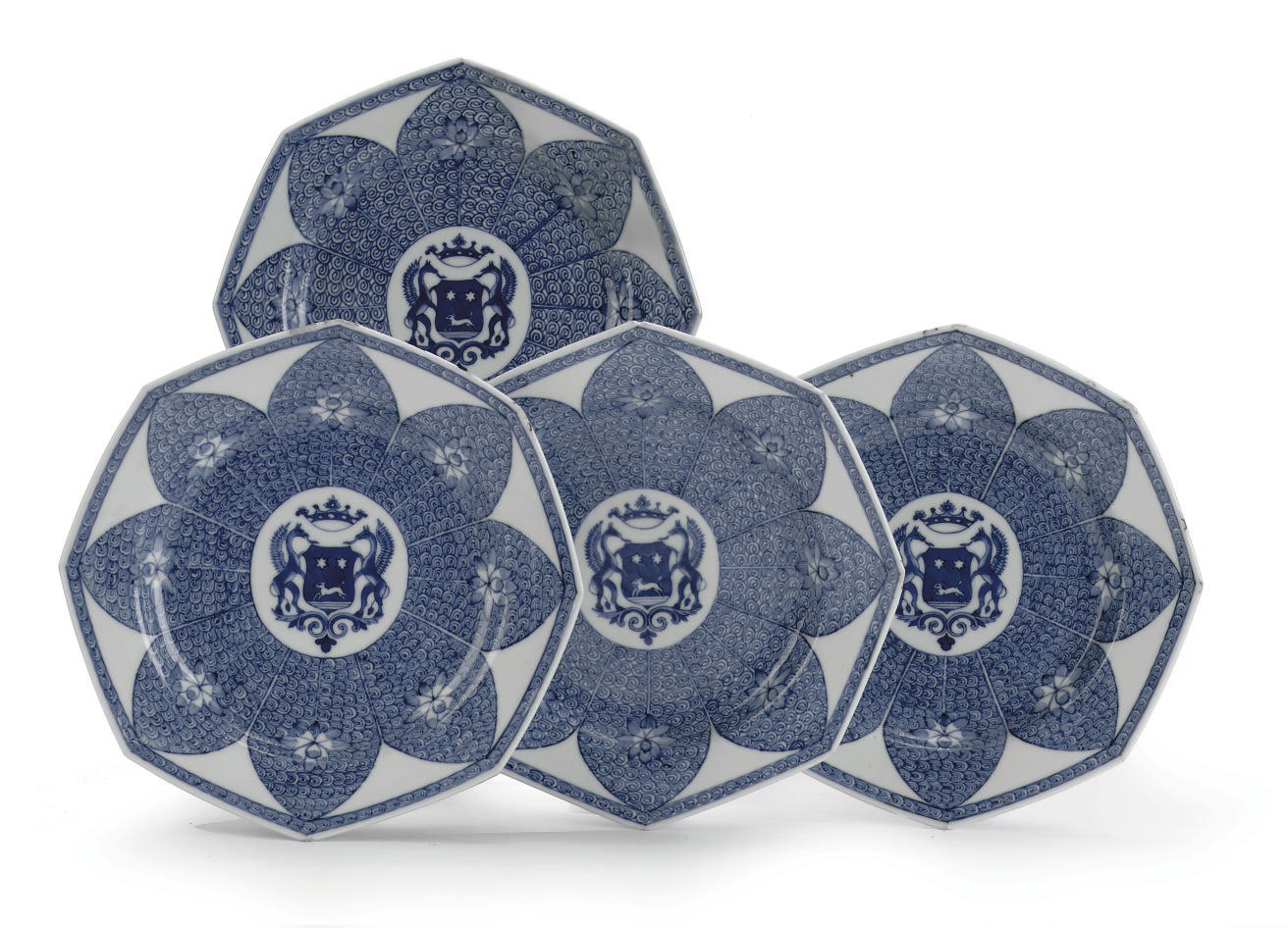 A set of four Chinese blue and white armorial plates