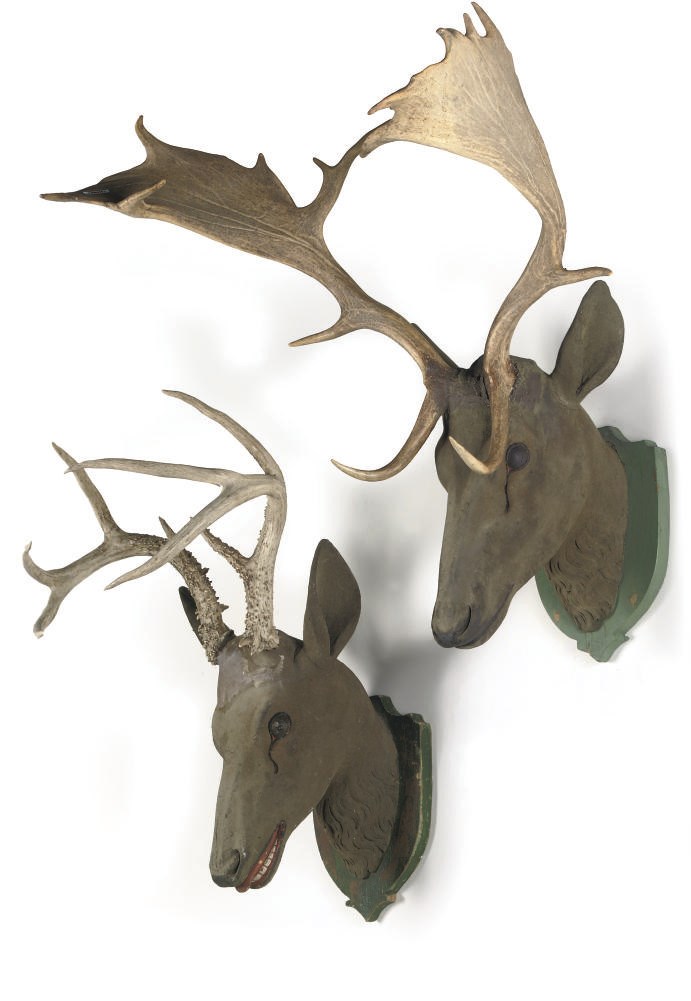 A PAIR OF GERMAN POLYCHROME CARVED WOOD AND ANTLER MOUNTED STAG'S HEAD TROPHIES
