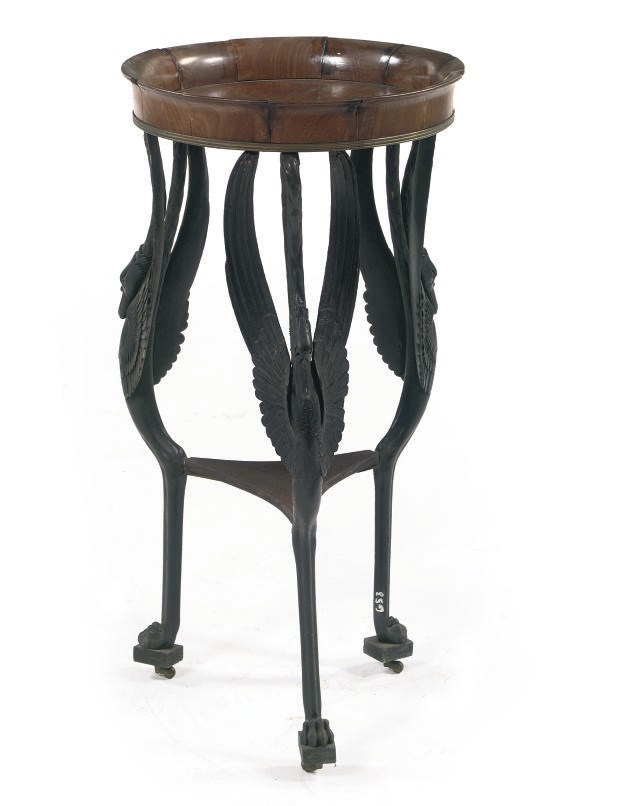 AN AUSTRIAN BRASS-MOUNTED MAHOGANY AND BRONZED GUERIDON