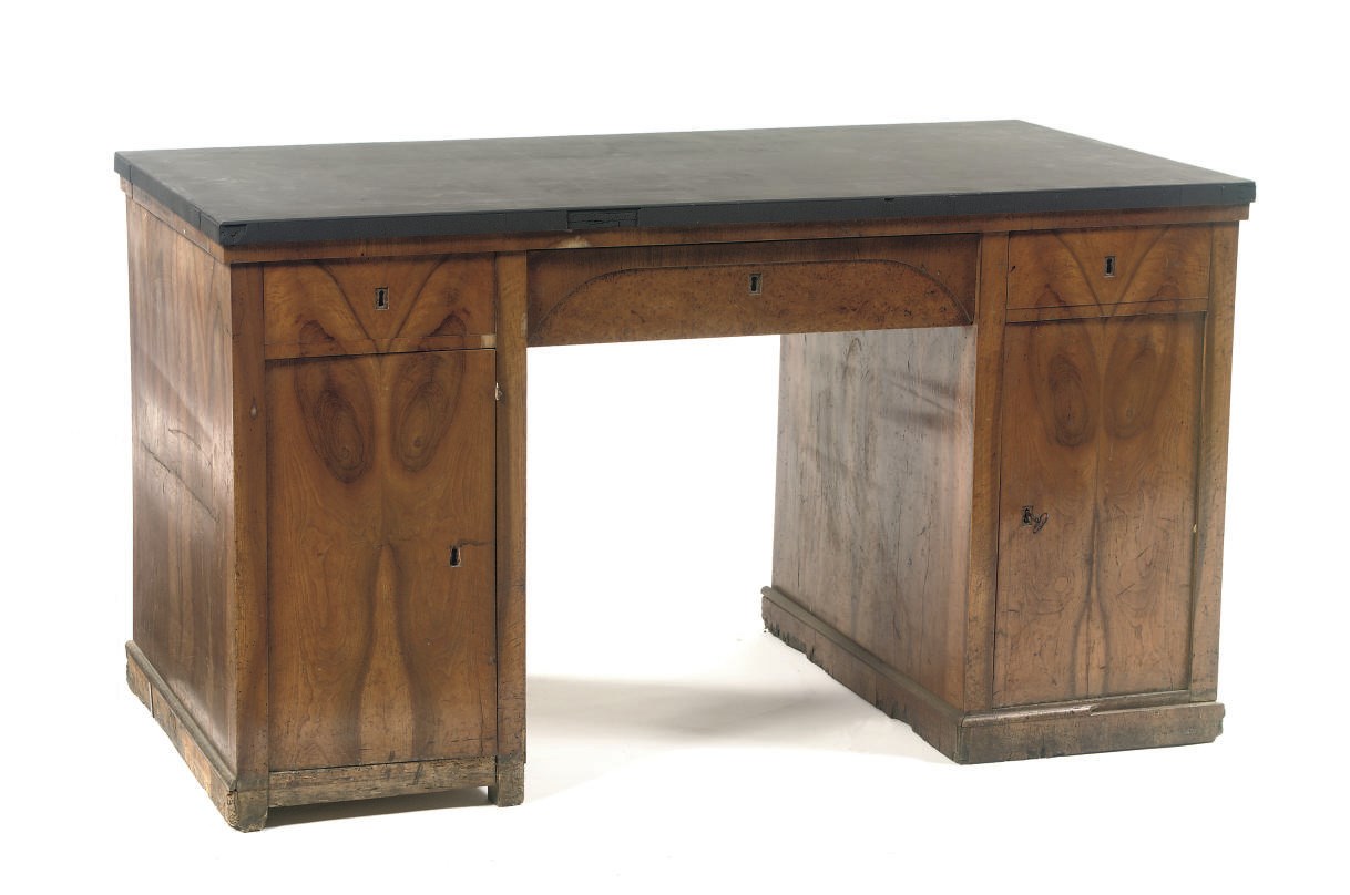 A GERMAN BIEDERMEIER WALNUT AND BURR BIRCH PEDESTAL DESK