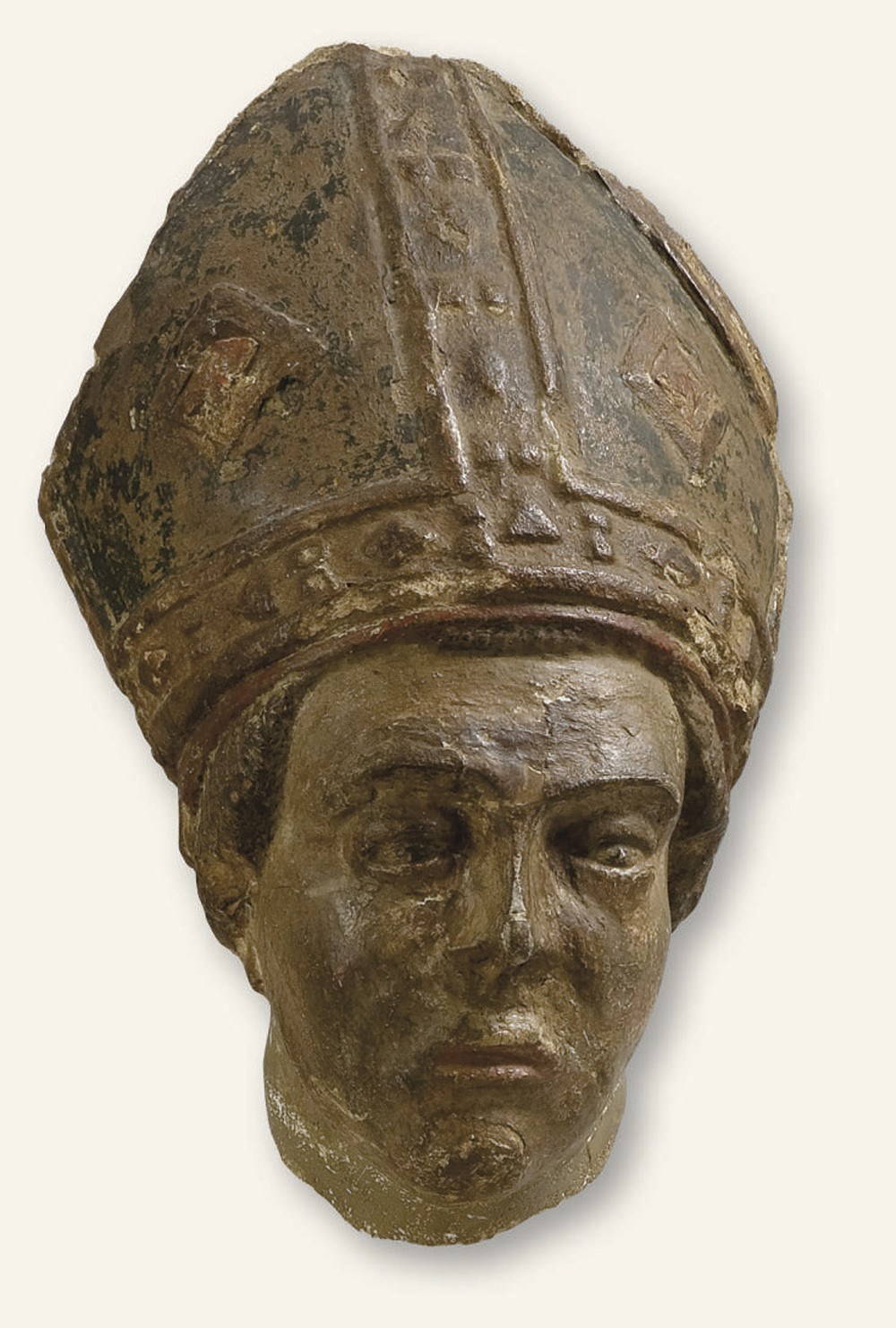 FRAGMENT DE TETE EN PIERRE CALCAIRE SCULPTEE ET PEINT POLYCHROME