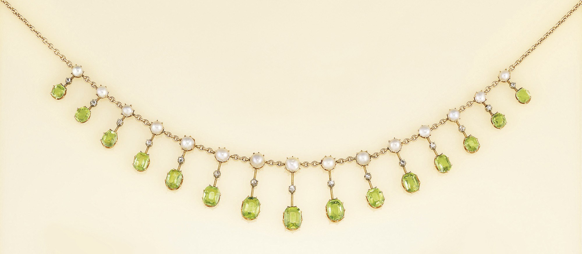 An Edwardian diamond, peridot and pearl fringe necklace