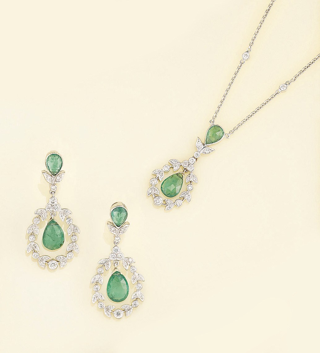 A pair of diamond and emerald earpendants and a pendant necklace