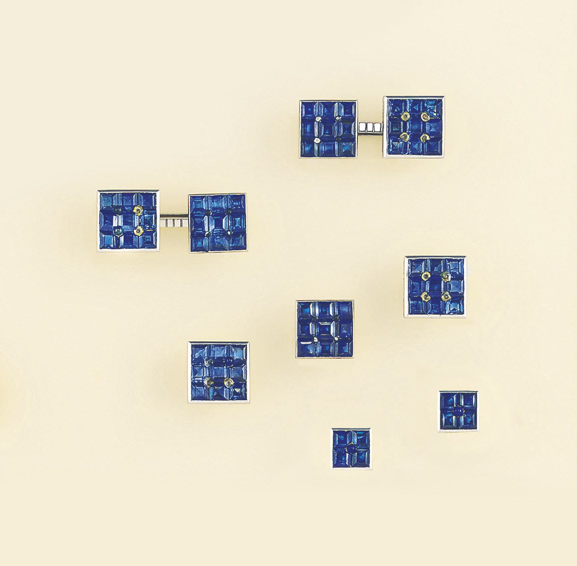 A French Art Deco platinum and sapphire dress-set, by Cartier