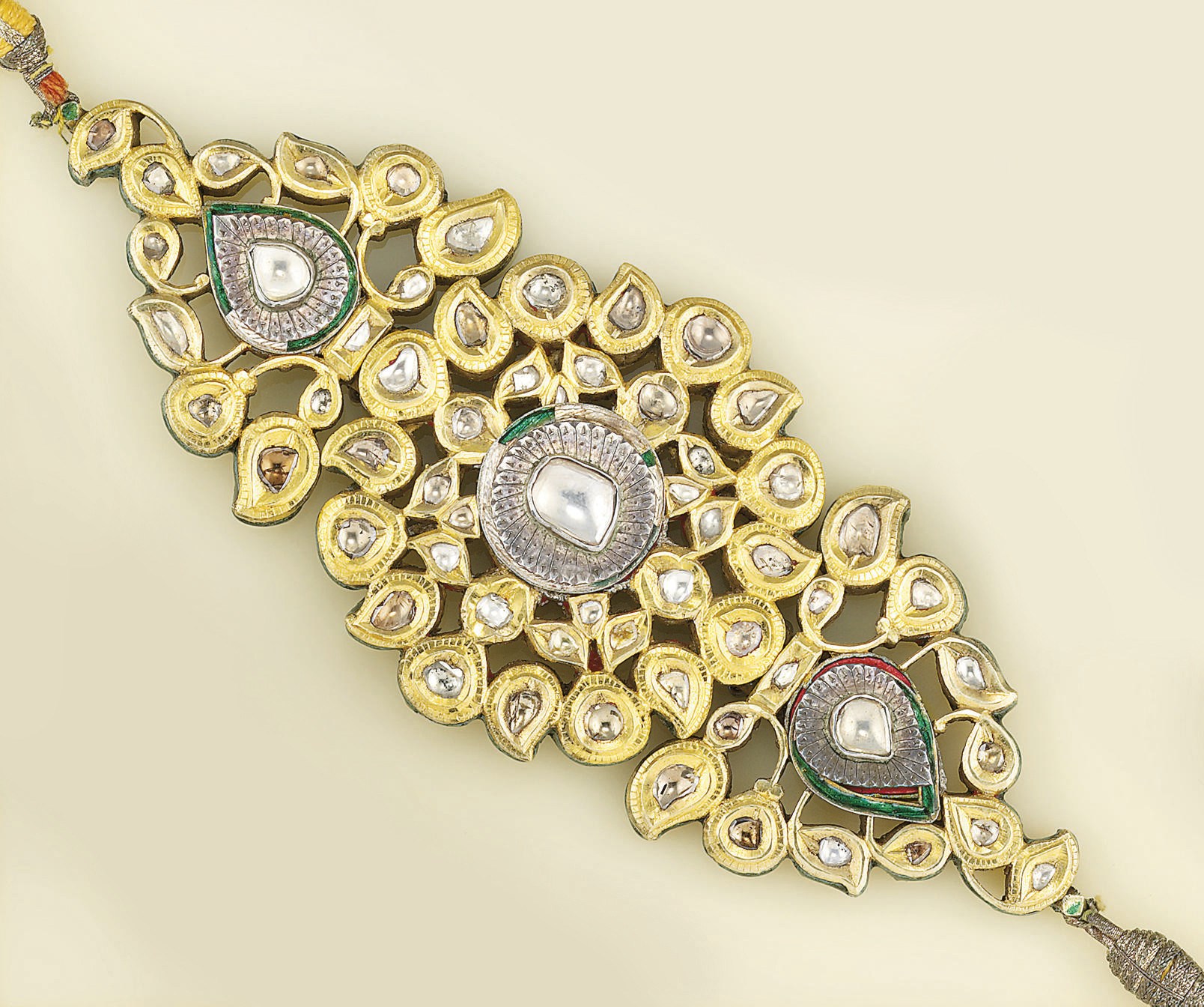 A 19TH CENTURY INDIAN DIAMOND AND ENAMEL BAZUBAND