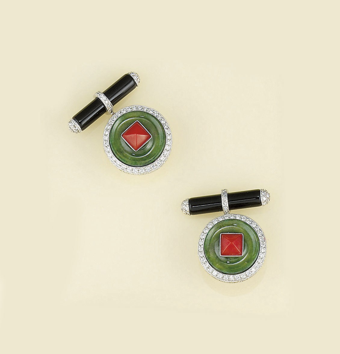 A pair of jadeite jade, coral, diamond and onyx cufflinks