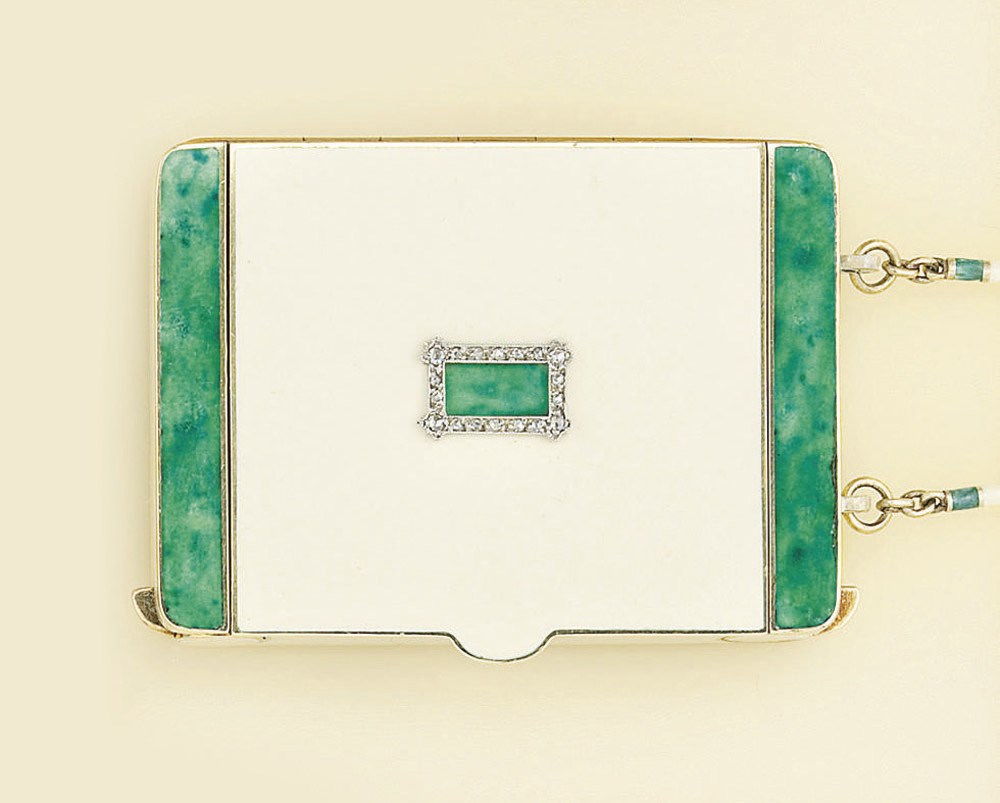 An early 20th century gold, enamel and diamond compact