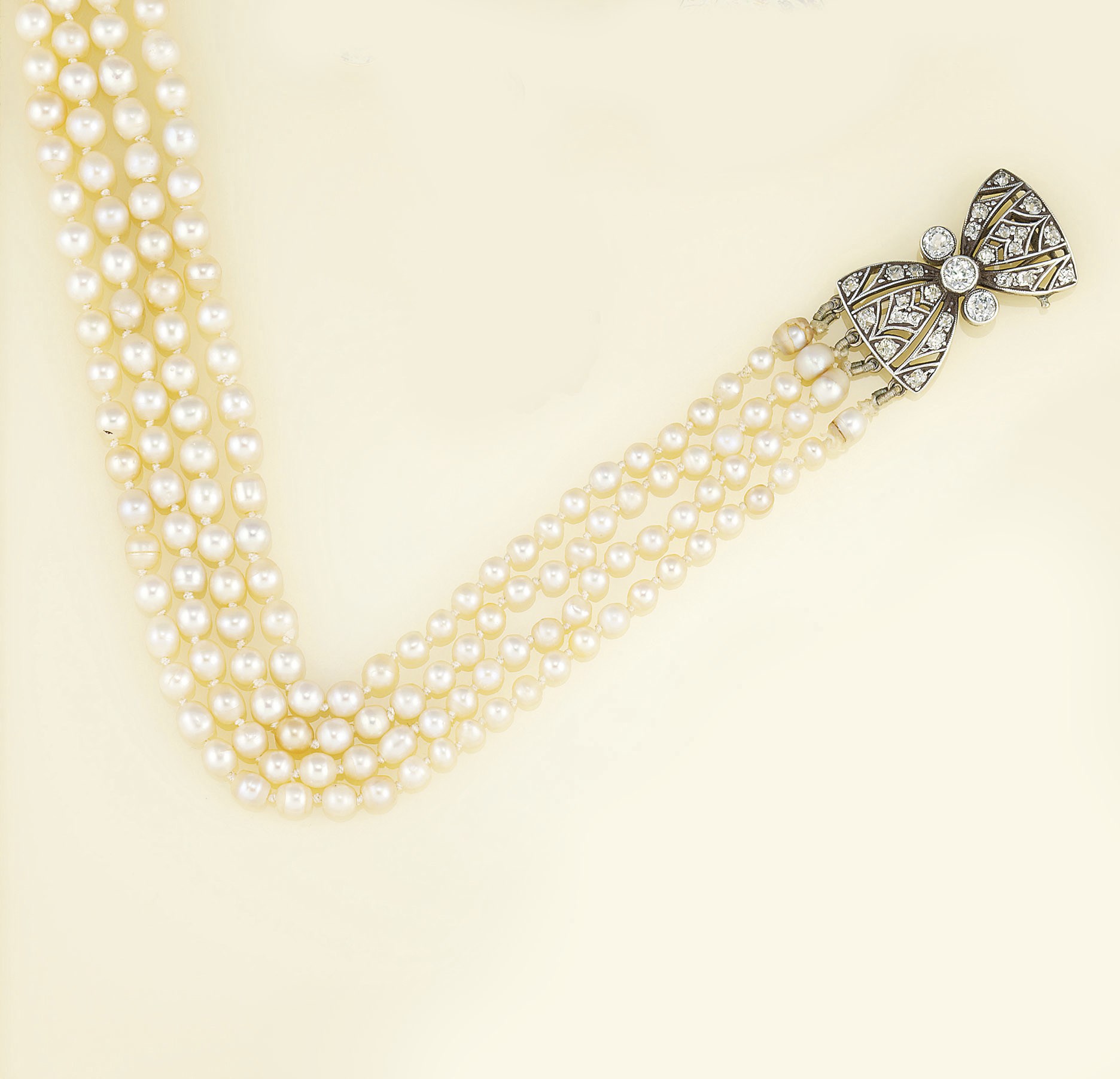 A pearl and diamond necklace