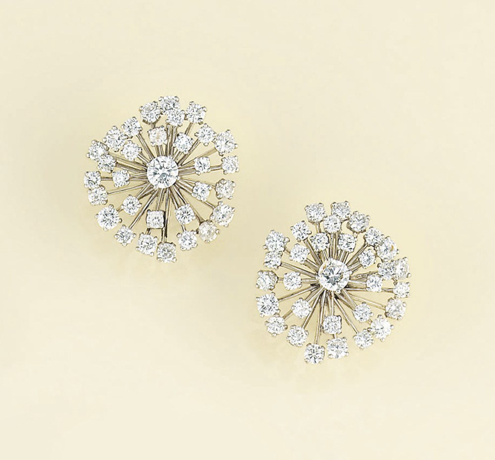 A pair of diamond earclips, by Cartier