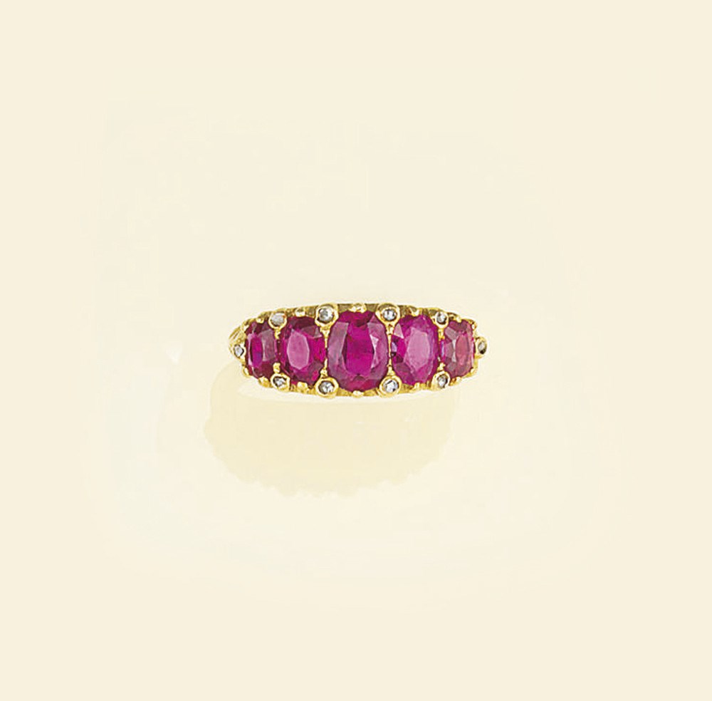 A ruby and diamond five stone ring