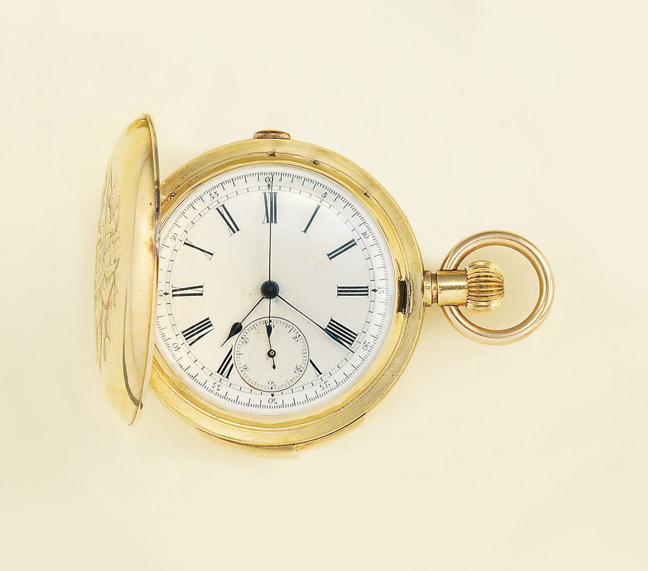 A gold hunting cased quarter repeating pocket watch, and a wristwatch, by Universal