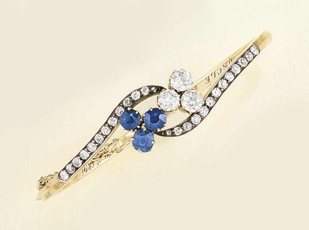 A late 19th century sapphire and diamond bangle