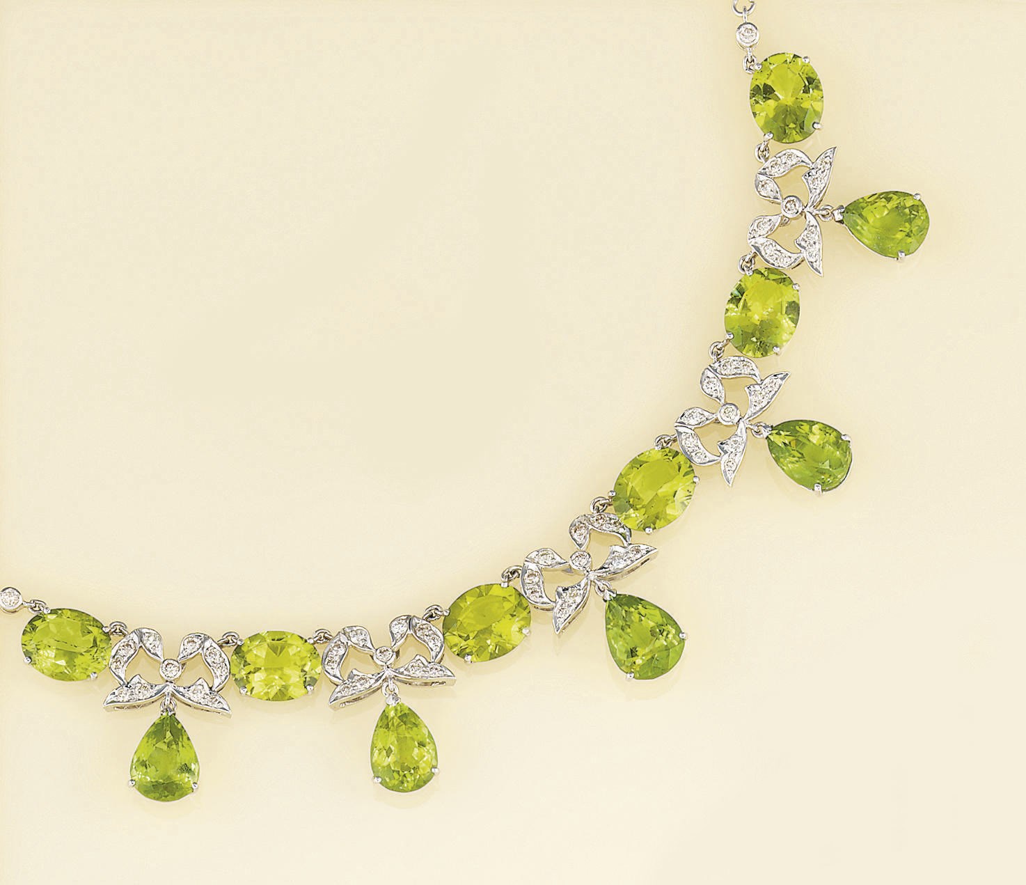 A peridot and diamond festoon necklace