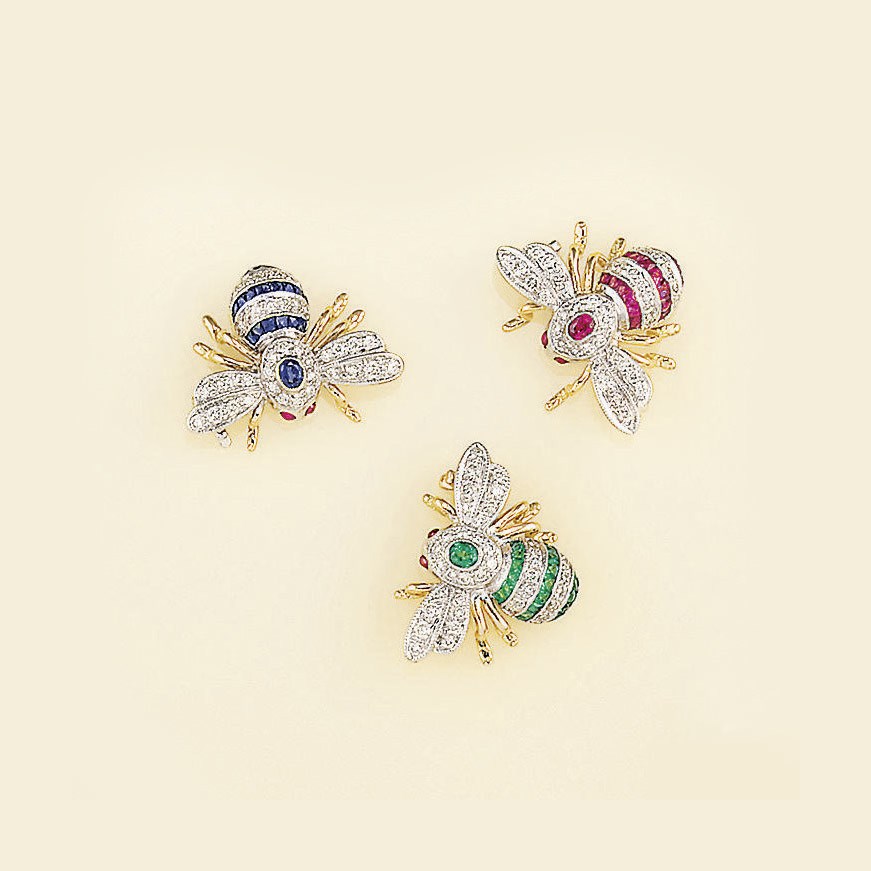 A set of three diamond and gem bee brooches