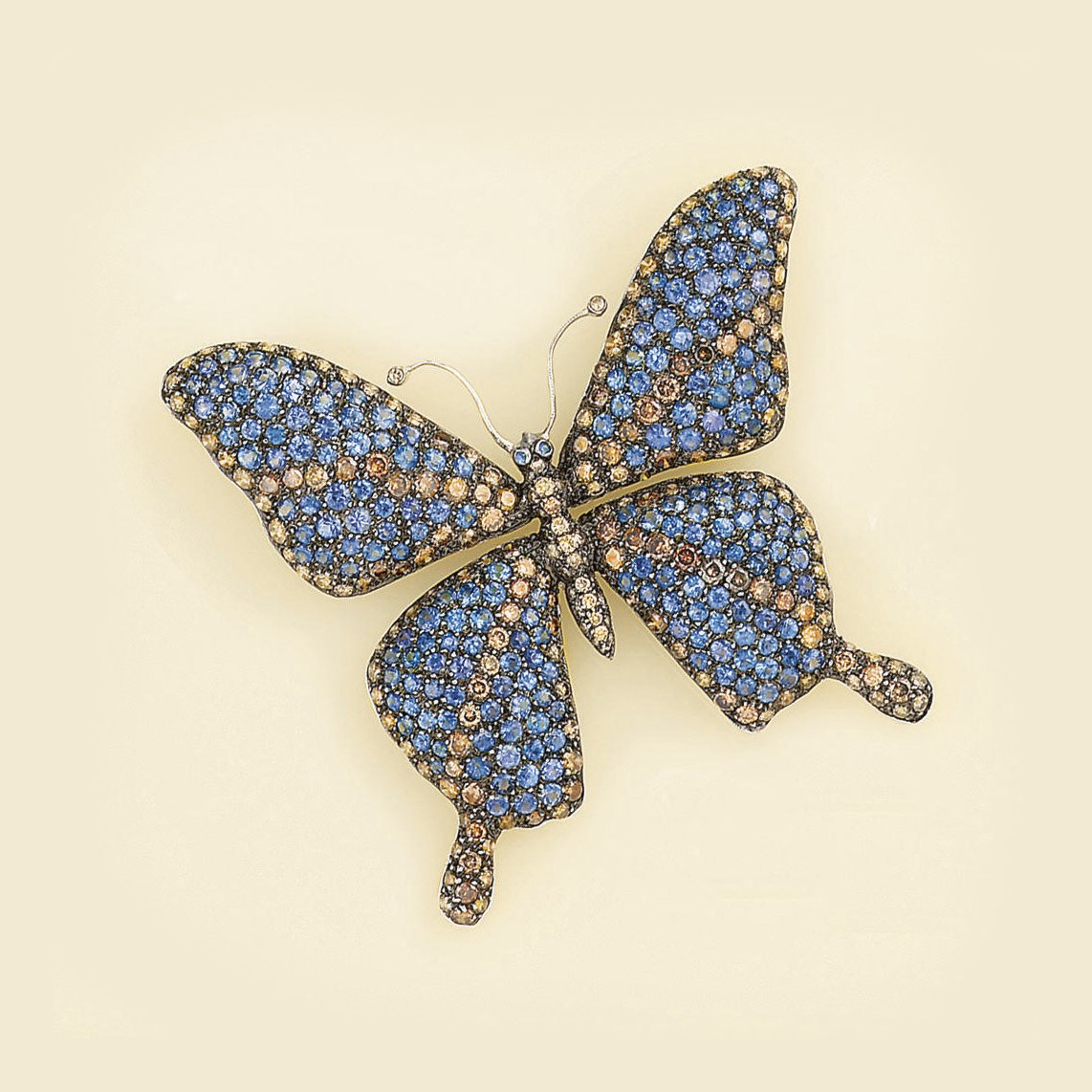 A coloured diamond and sapphire butterfly brooch