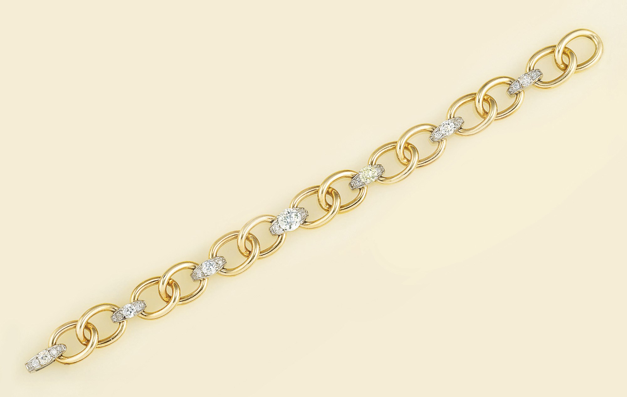 A gold and diamond bracelet, by Cartier