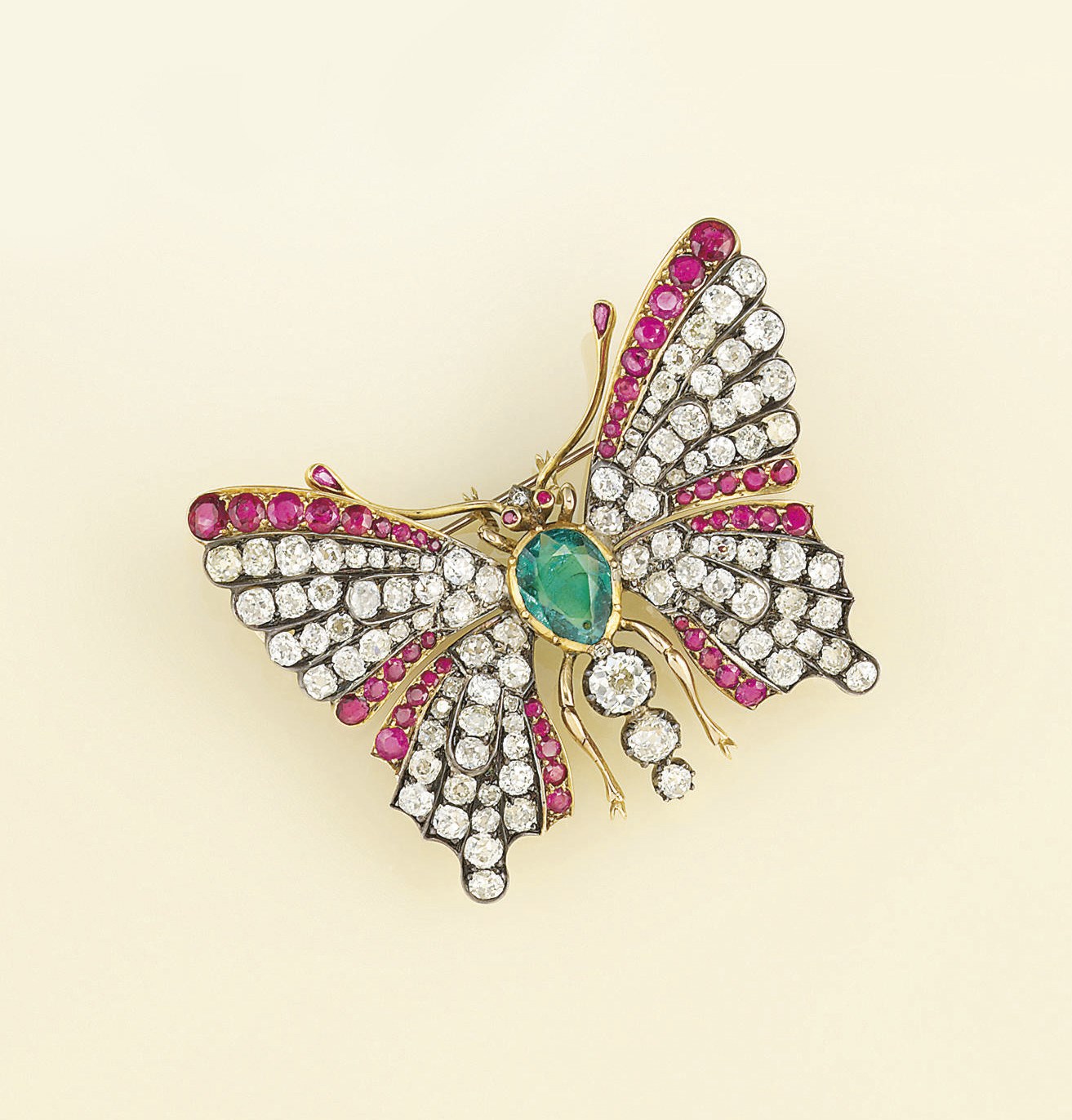 A late 19th century diamond, emerald and ruby butterfly brooch