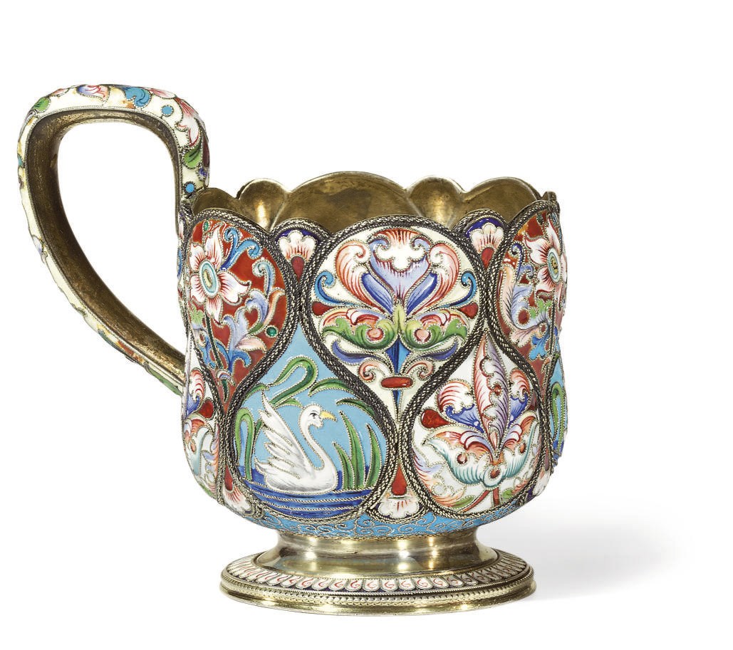 A SILVER-GILT AND CLOISONNÉ ENAMEL TEA GLASS HOLDER
