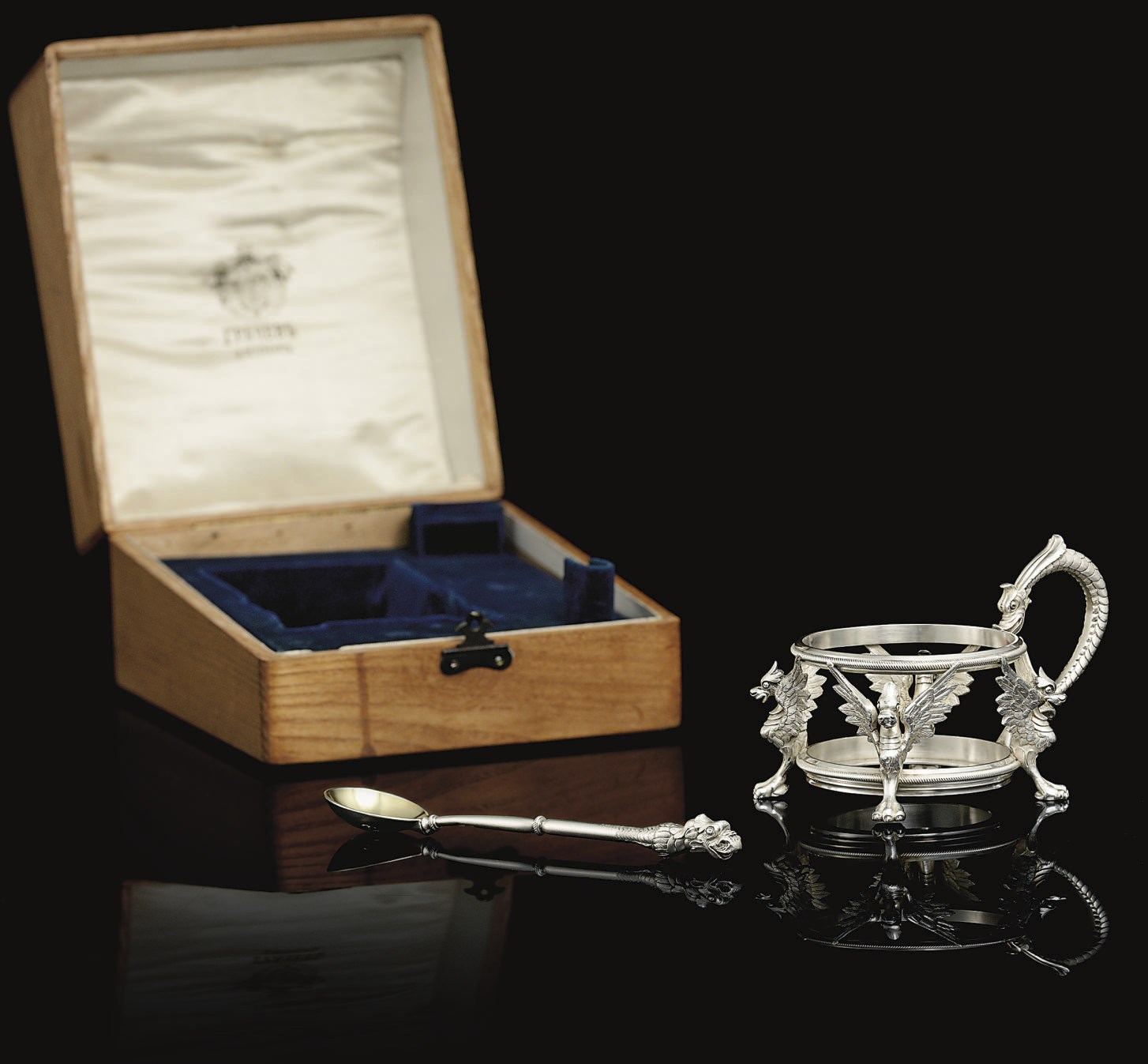 A Silver Tea Glass Holder and Teaspoon