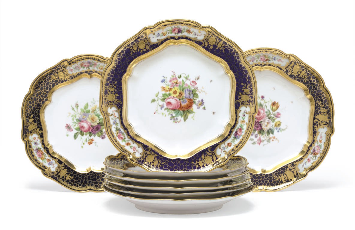 A Set of Eight Porcelain Dinner Plates