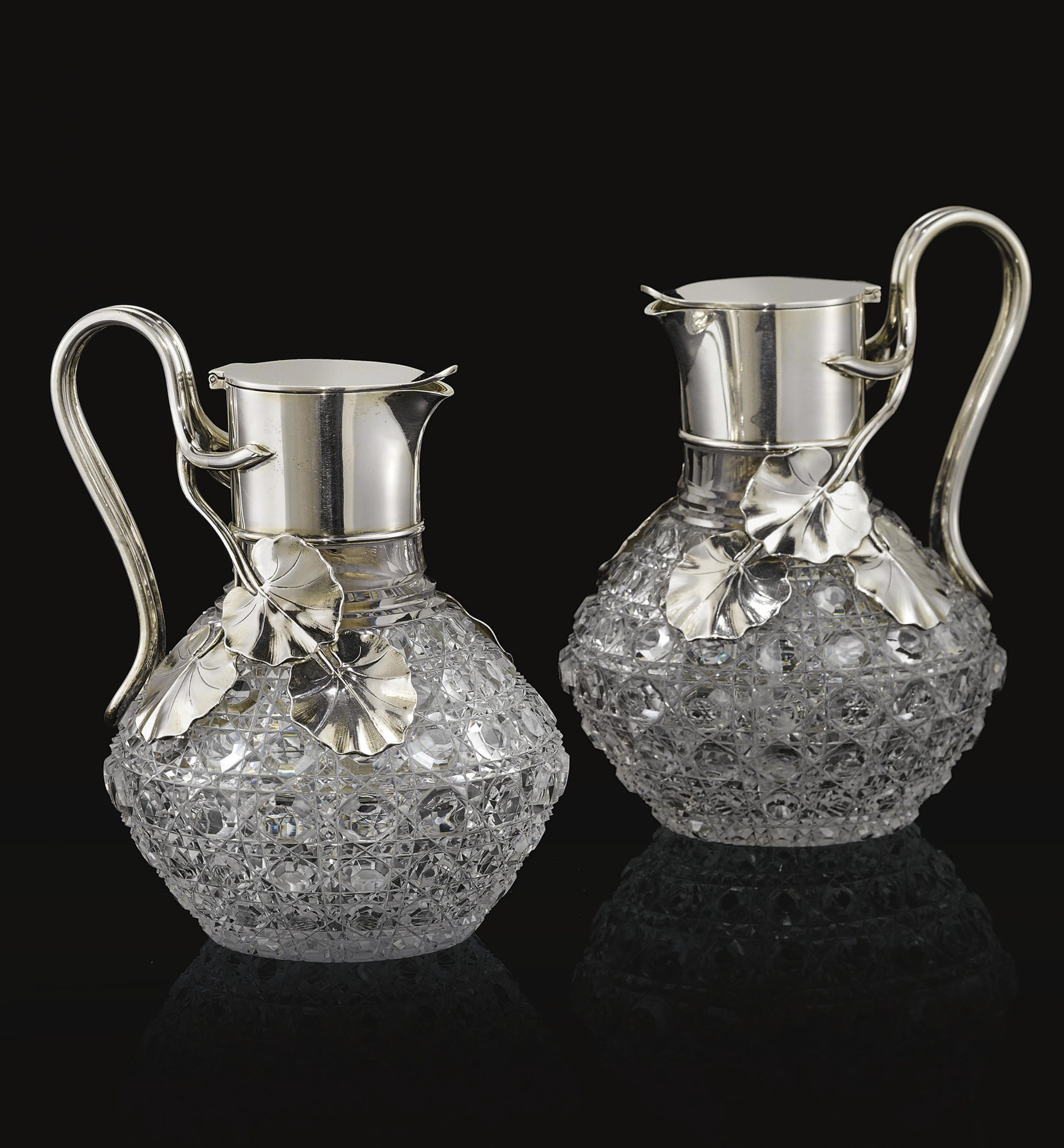 A Pair of Silver-Mounted Glass Jugs