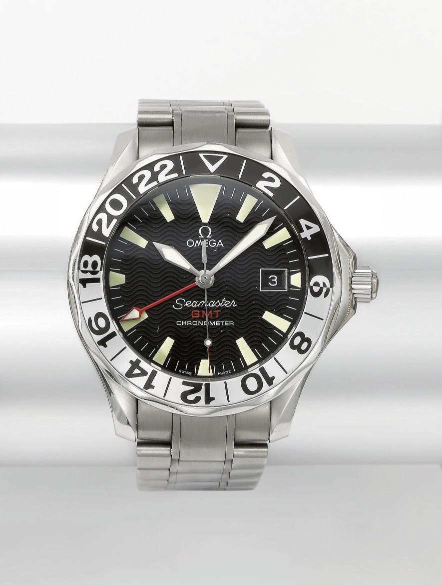 Omega. A stainless steel automatic dual time wristwatch with date and titanium bracelet