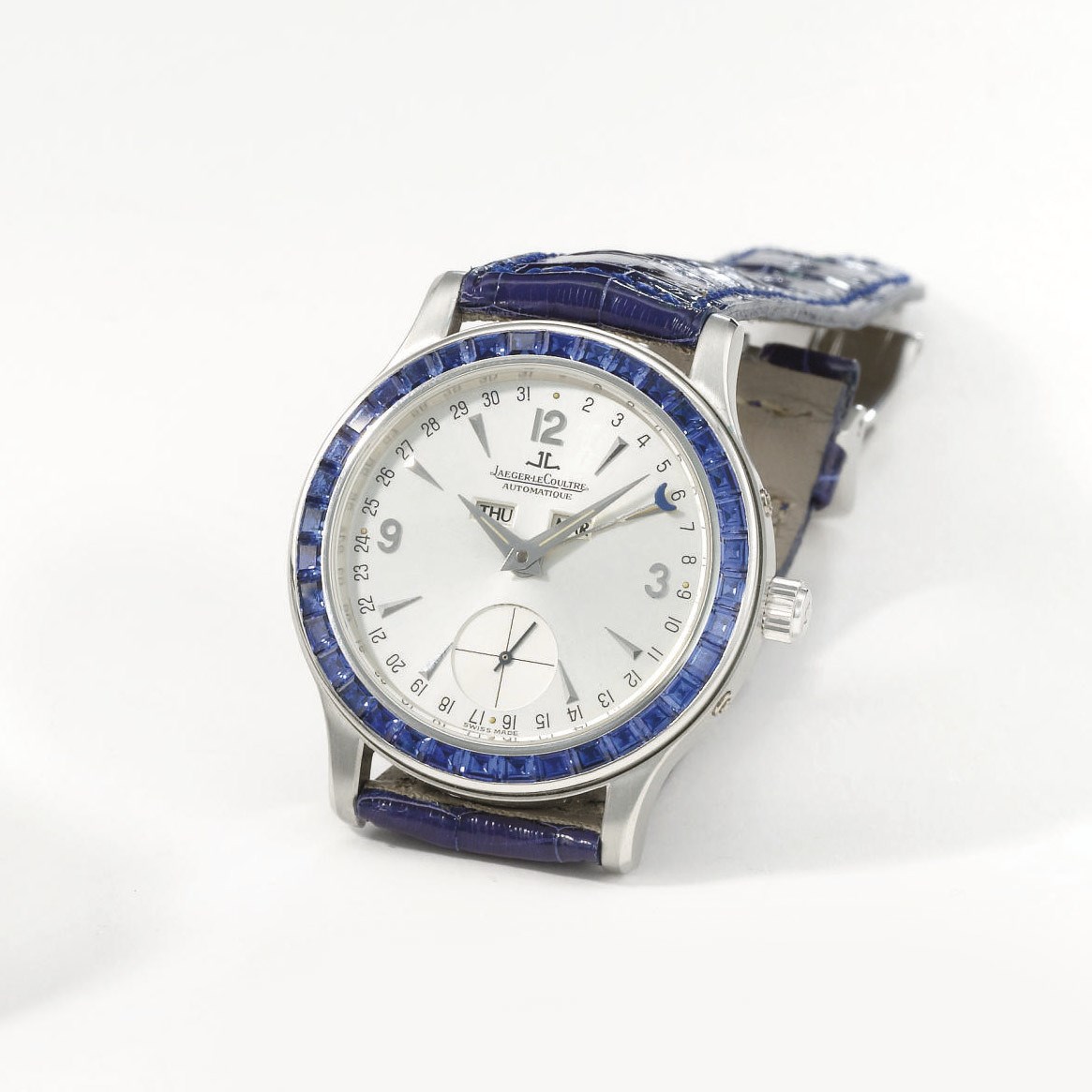 Jaeger-LeCoultre. A fine and rare platinum and sapphire-set automatic triple calendar wristwatch