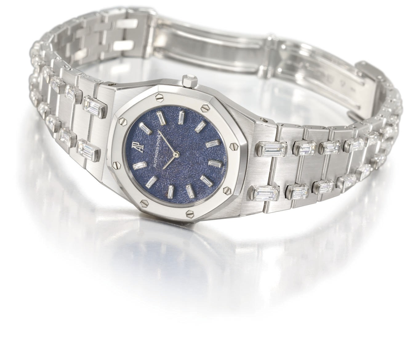 Audemars Piguet. A lady's fine 18K white gold and diamond-set wristwatch with textured blue dial and diamond-set bracelet
