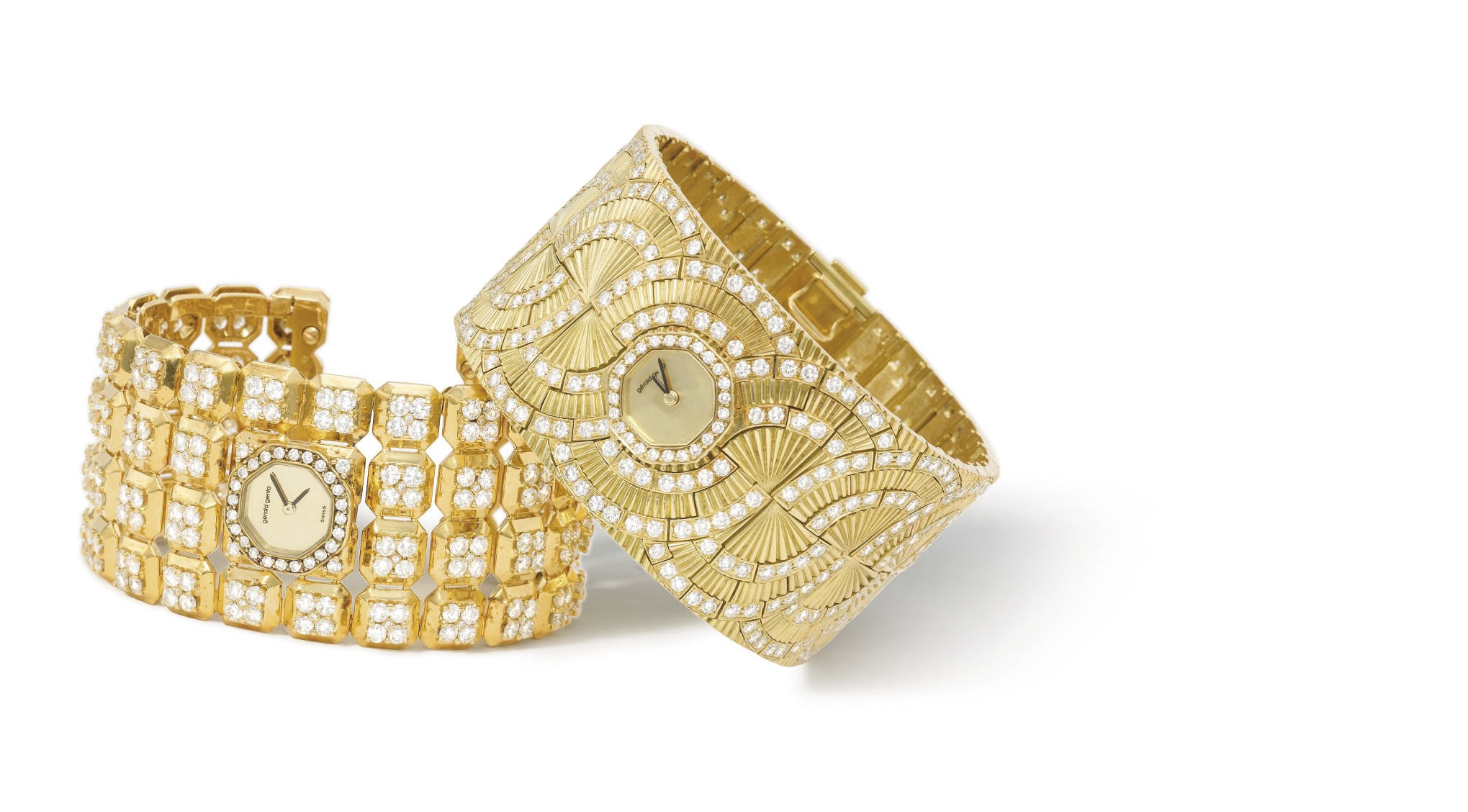 Gérald Genta. A lot of two 18K gold and diamond-set bangle wristwatches