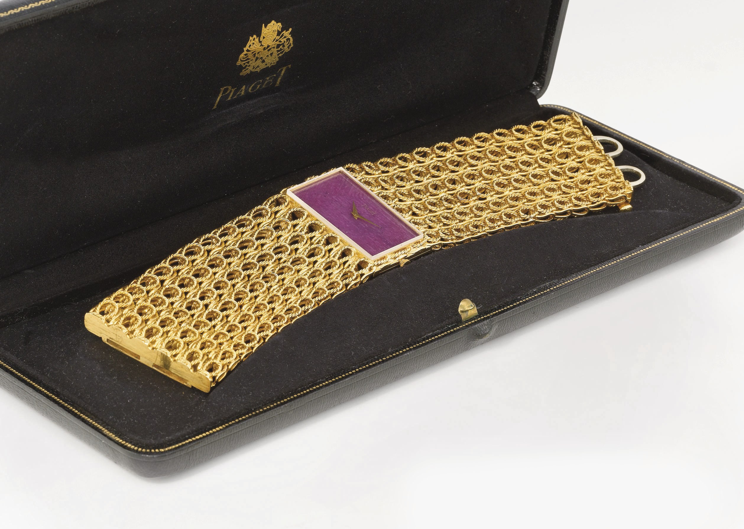 Piaget. A highly unusual 18K gold and red hardstone oblong bracelet wristwatch with box