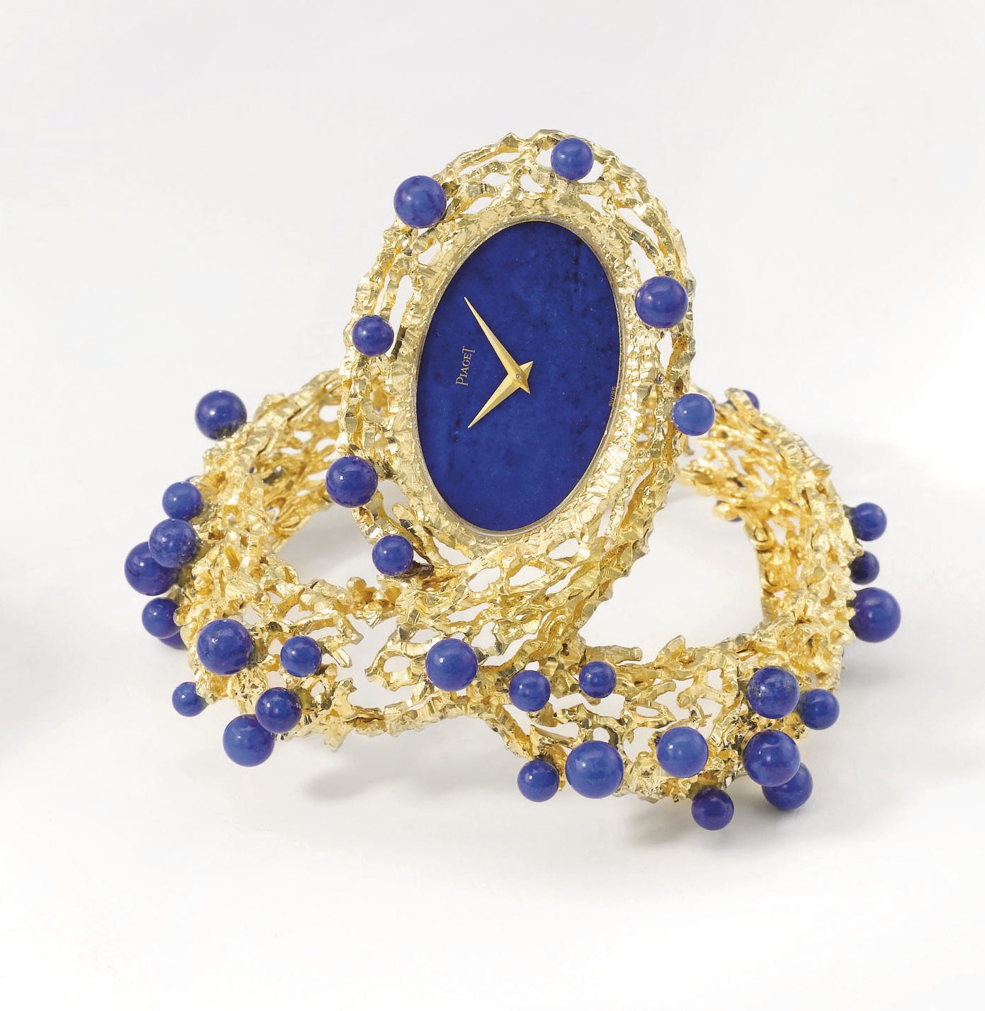 Piaget. A highly unusual and attractive 18K gold and lapis lazuli bracelet wristwatch